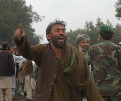 a man shouts anti-American slogans after the attack