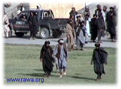 Taliban soldiers led Daoud, whose eyes were covered with a white scarf, into the stadium