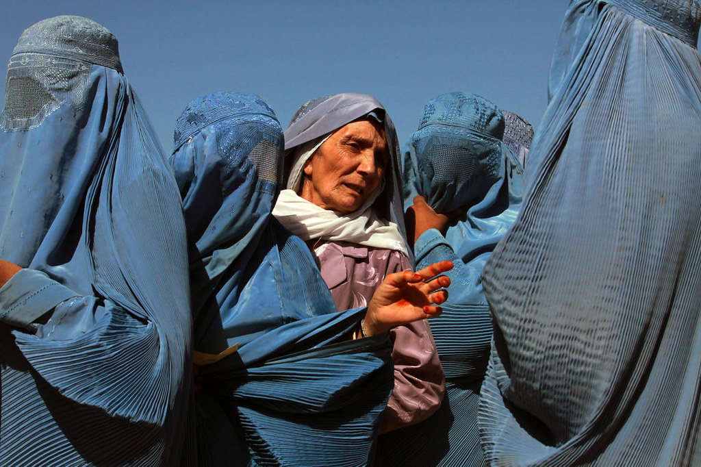 afghan women line up at a world food program