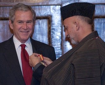Hamid Karzai presented the Ghazi Amanullah Khan Medal to Bush