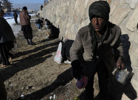 Afghan drug addicts use heroin and other narcotics near the Kabul River