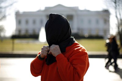 A protester outside the White House in Washington dressed as a Guantanamo Bay detainee