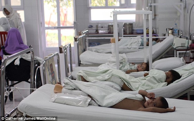 Lost limbs: Ismail, aged five, in the foreground. The children share a ward with women