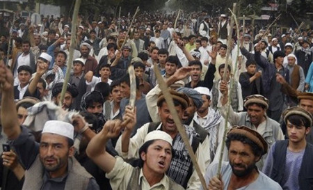 Afghans shout anti U.S. slogans during a demonstration in Taloqan, Takhar province, north of Kabul, Afghanistan on Thursday, May 19, 2011