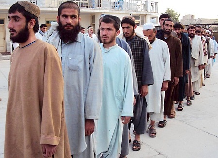 Some of the inmates who escaped this week from a prison in Kandahar are displayed after recapture. Seventy-five of the 488 who fled were back in custody