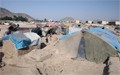 Returning Afghans survive in tent camps