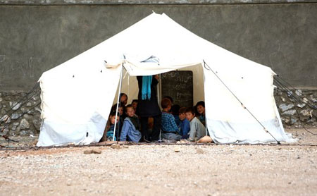 Afghan children attend class in a tent in Bamiyan province, west of Kabul