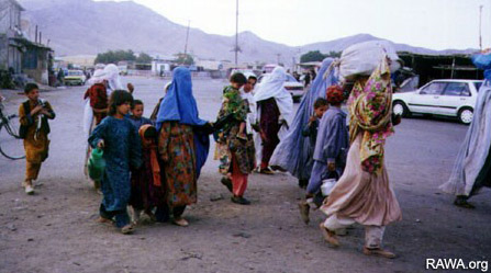 Women and children fleeing the Taliban attack on Shamali in 1999