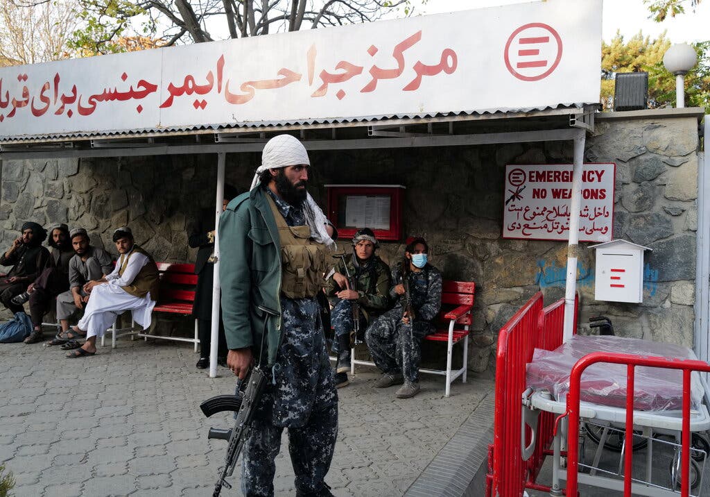 Talibs waiting to hear about injured comrades at the entrance of the hospital. 
