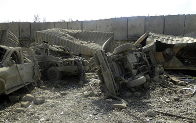 A view shows damaged vehicles inside a U.S. base after a twin suicide bomb attack in Wardak province September 1, 2012