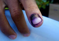 Afghans scrub fingers clean to cast extra votes