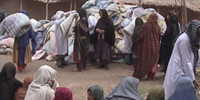 RAWA distributes quilts among refugees
